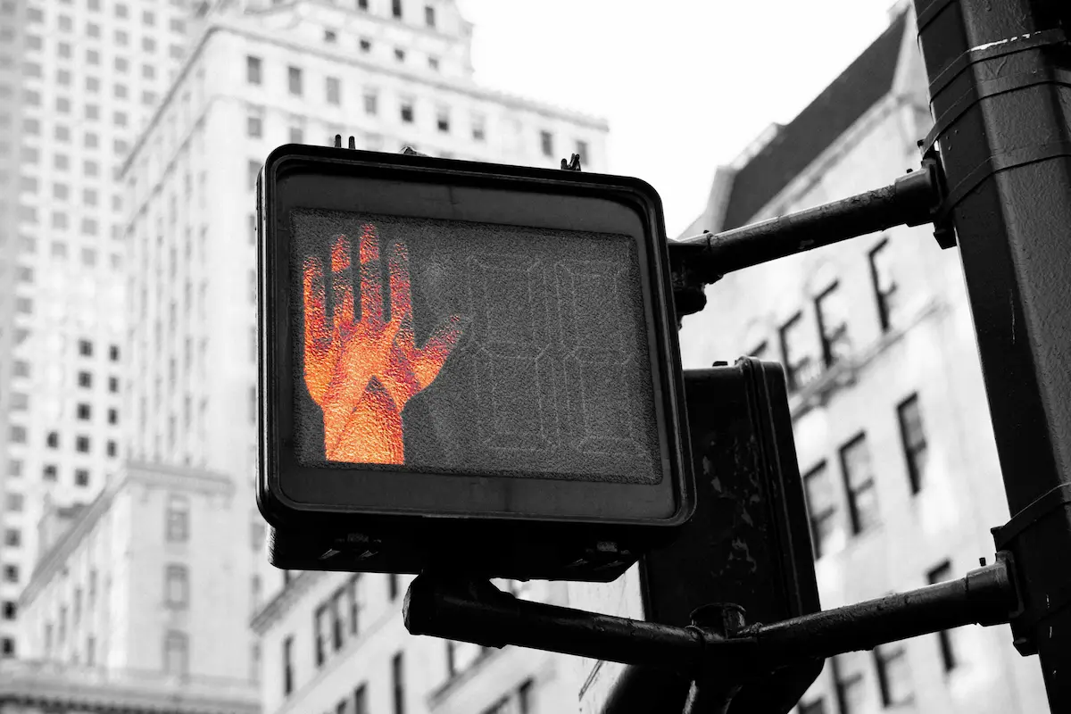 Red hand signal on pedestrian traffic light.