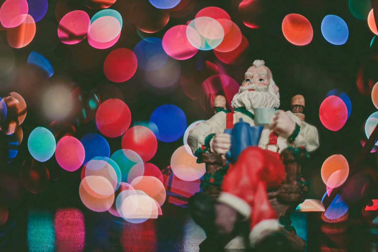 Santa figurine with colorful bokeh lights