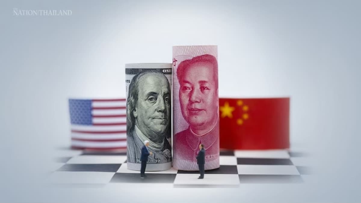 US and China currency on chessboard background.
